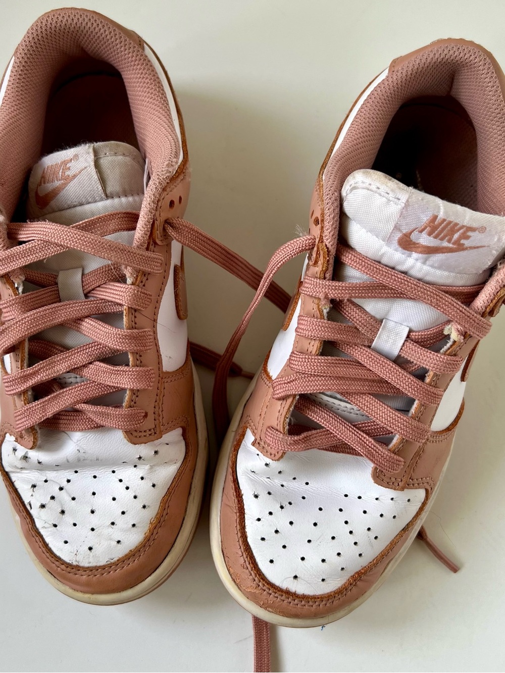 Nike Women’s Dunks Low-Top Sneakers in White and Dusty Rose